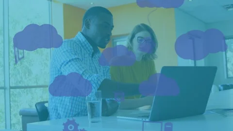 Animation of graphical clouds and computer icons over diverse coworkers Stock Footage 326750605