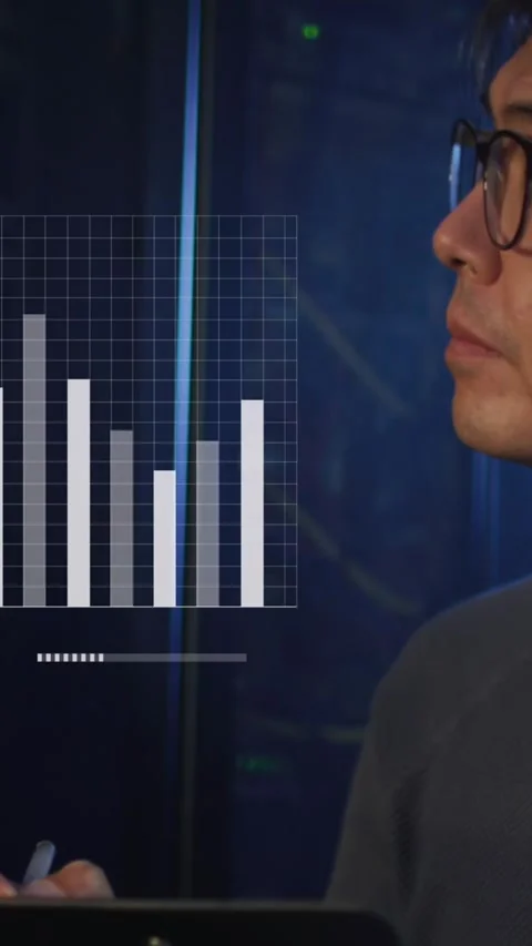 Animation of graphs and data over asian man working in server room Stock Footage 342641893