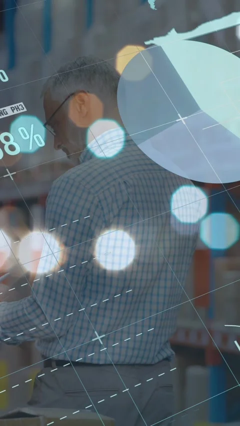 Animation of graphs and financial data over caucasian male warehouse worker Stock Footage 343827571