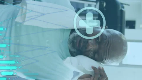 Animation of graphs and icons over tired african american man wiping head with Stock Footage 312472269