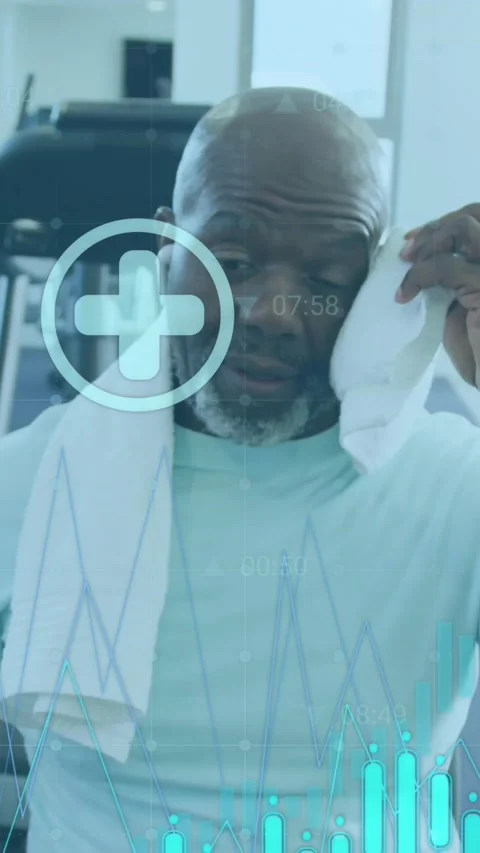 Animation of graphs and icons over tired african american man wiping head with Stock Footage 320811764