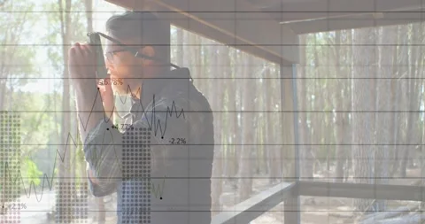 Animation of graphs and numbers over caucasian male photographer clicking photos Stock Footage 330474296