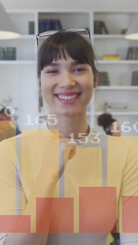 Animation of graphs with changing numbers over smiling woman standing in office Stock Footage 344693597