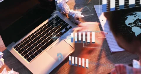 Animation of graphs, computer language and globes, overhead view of man working Stock Footage 330344681
