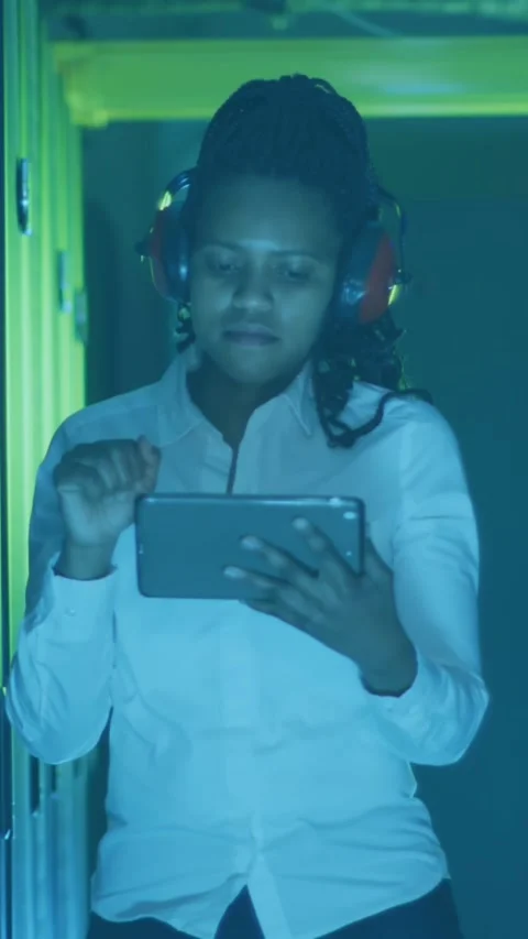 Animation of graphs, data, map, african american female engineer checking data Stock Footage 344614402