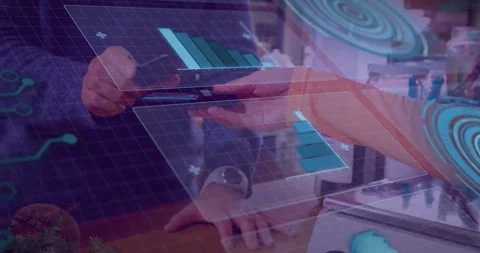 Animation of graphs on digital screen over hands of caucasian man using 库存影片 329853607