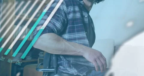 Animation of graphs, globe and computer language over handicap caucasian man Stock Footage 253482207