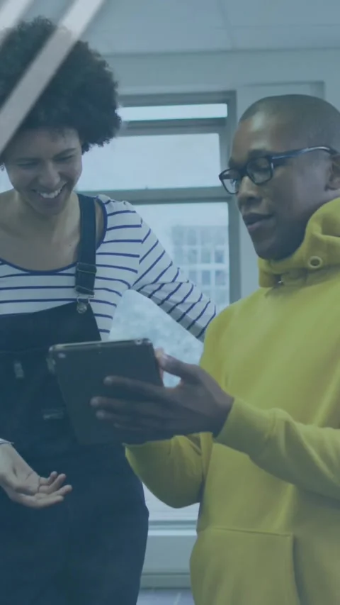 Animation of graphs, globe and computer language over diverse coworkers Stock Footage 321039181