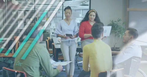 Animation of graphs, globe and computer language over diverse coworkers sharing Stock Footage 326037148
