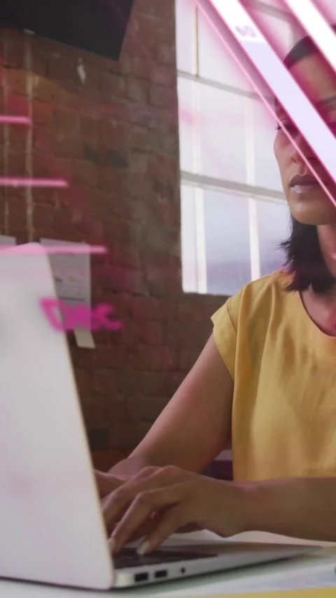 Animation of graphs, globe and computer language over woman working on laptop Stock Footage 342612244