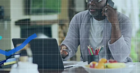 Animation of graphs, grid pattern, african american man looking at laptop and Stock Footage 330780249
