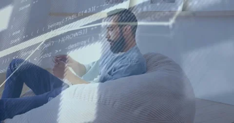 Animation of graphs, lines and computer language over caucasian man using Stock Footage 329772009