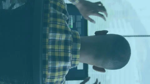 Animation of graphs, map, rear view of programmer relaxing after completing Stock-Footage 312797826