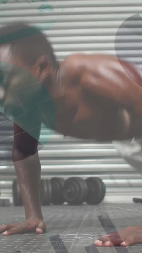 Animation of graphs over african american man exercising at gym, doing push ups Stock Footage 343778809