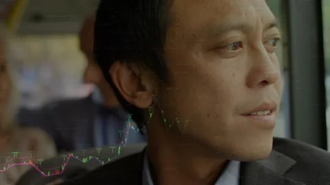 Animation of graphs over asian man looking through window of bus Stock Footage 227038591