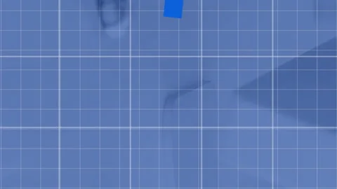 Animation of graphs over grid pattern against keyboard and computer on desk in Stock Footage 312717865