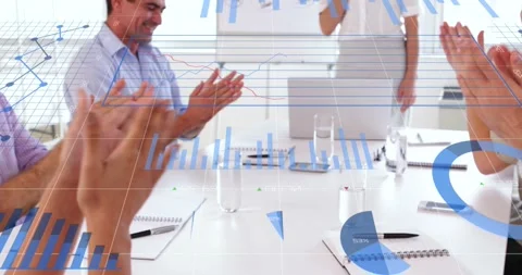 Animation of graphs over happy caucasian businesspeople clapping hands in office Stock Footage 327123655