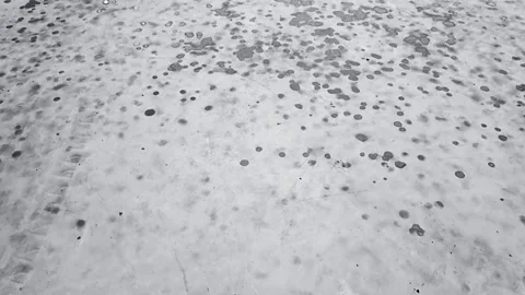 An animation of gray and black raindrops forming circular patterns on a whi.. Stock Footage 300075817