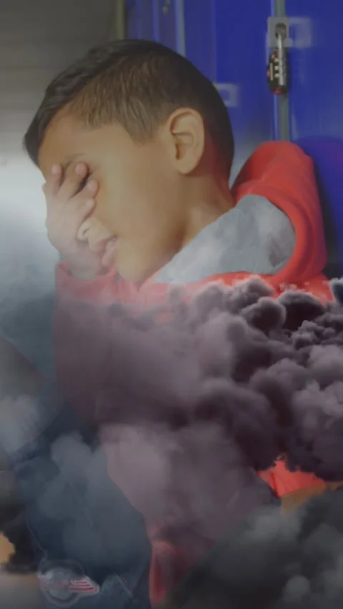 Animation of grey clouds over schoolboy crying Stock Footage 322209569