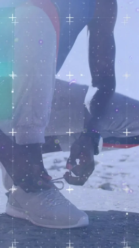 Animation of grid over a running african american man tying shoe Stock Footage 341953142