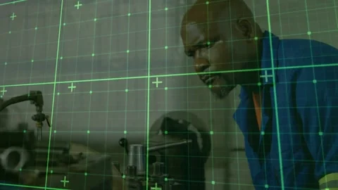 Animation of grid pattern over african american man using machinery at factory Stock Footage 246961423