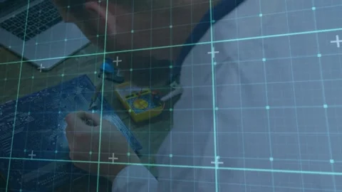 Animation of grid pattern over high angle view of caucasian male engineer Stock Footage 246961425