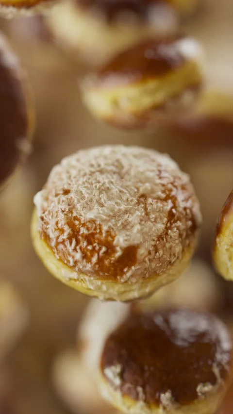 Animation of a group of donuts. Defocus. Close-up. Stock Footage 312576404