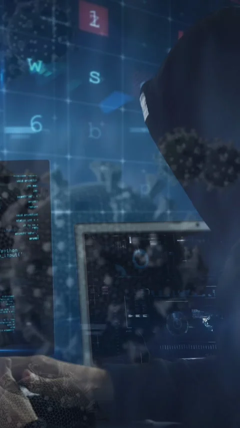 Animation of a hacker hooded man with two computers and information in red Stock Footage 342641559