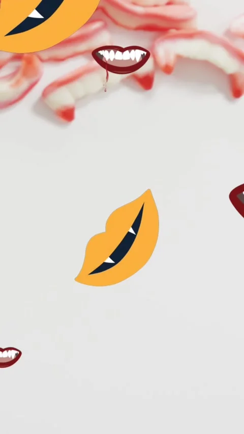 Animation of halloween vampire teeth moving over sweets on grey background Stock Footage 343497630