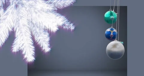 Animation of hanging baubles, gift box with illuminated pine tree against gray Stock Footage 329782734