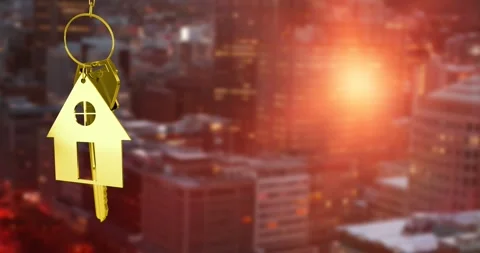 Animation of hanging house shaped key chain over illuminated modern buildings in Stock Footage 330251197