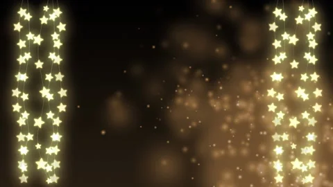 Animation of hanging string light stars with glowing embers floating on a dark Stock Footage 148552396
