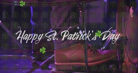 Animation of happy st patrick's day text and clover icons over man playing drums Stock Footage 328351585