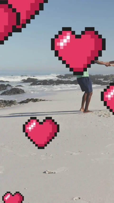 Animation of heart digital icons over couple dancing on beach Stock Footage 342004199