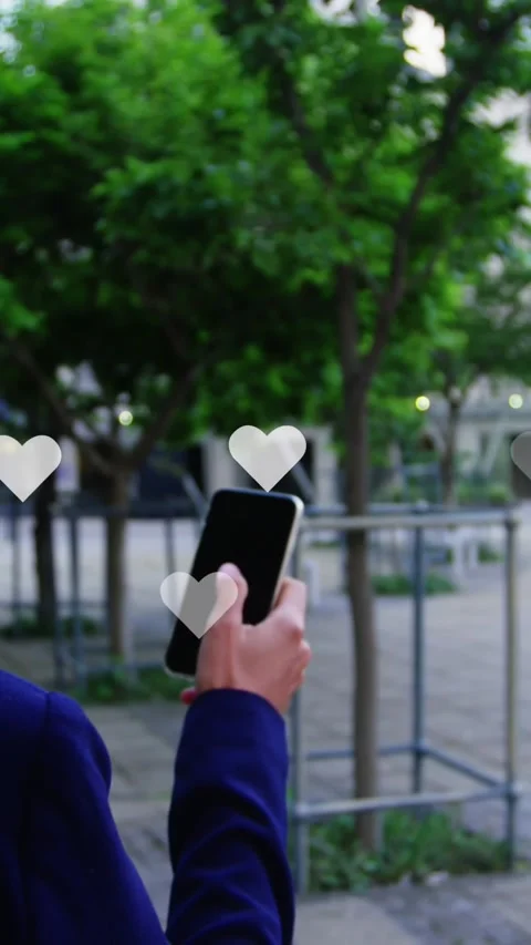Animation of heart icons floating over african american businesswoman using Stock Footage 344635939