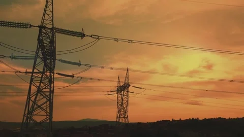 Animation of high voltage power lines with blue electrical energy pulses at.. Stock Footage 337472050