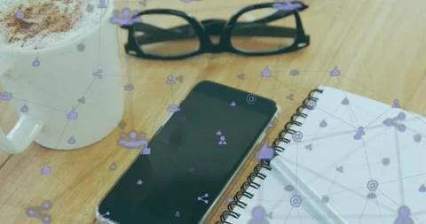 Animation of icons connected with lines over spectacles, cellphone, notepad and Stock Footage 249794801