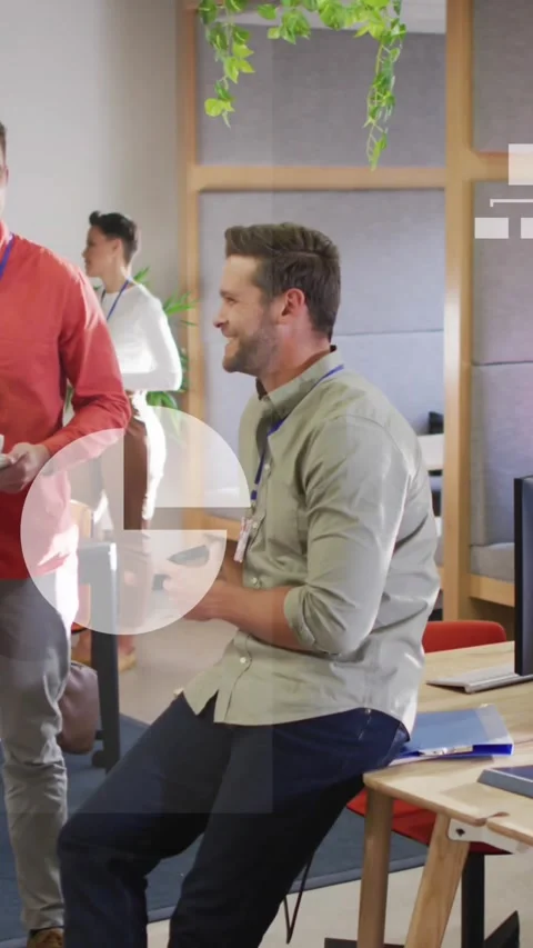 Animation of icons, graphs, map and computer language over diverse coworkers Stock Footage 344595143