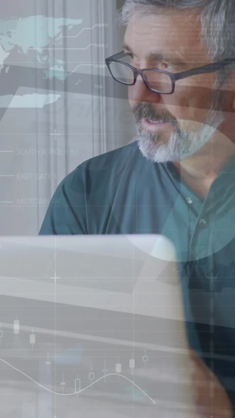 Animation of infographic interface over caucasian man wearing spectacles working Stock Footage 321216356