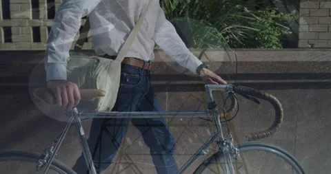 Animation of infographic interface, pylons, midsection of caucasian man walking Stockbeeldmateriaal 330593989