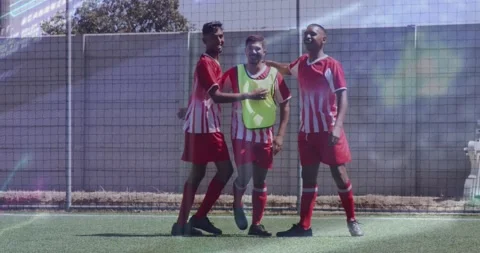 Animation of interface processing data over male footballers celebrating on Stock Footage 329508781