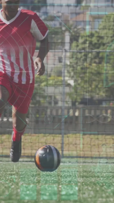 Animation of interface processing data over male footballer training on pitch Stock Footage 342009532