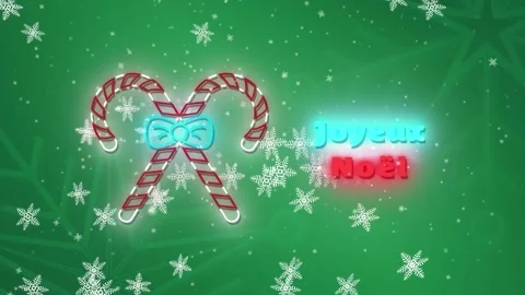 Animation of joyeux noel text with candy canes over snowflakes on green Stock Footage 328087229