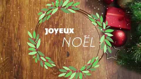 Animation of joyeux noel text over christmas decorations on wooden background Stock Footage 328410879