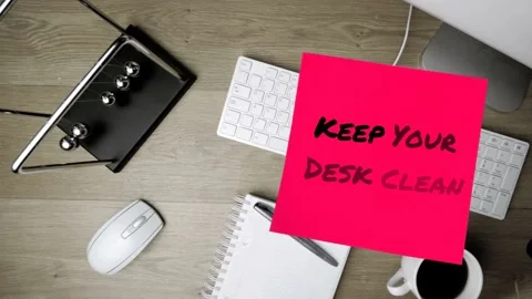Animation of keep your desk clean text over computer keyboard with notebook and Stock Footage 167998811