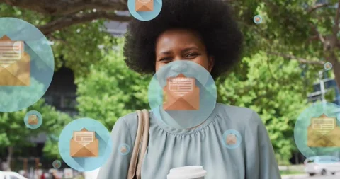 Animation of letter on envelope in circles over smiling african american woman Stock Footage 329920499