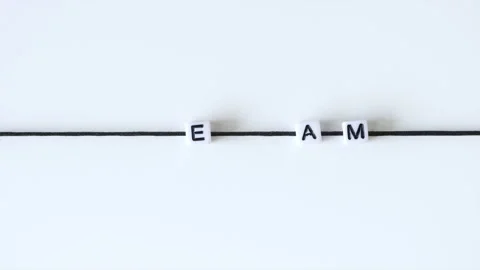 Animation of letters in a motion making word "team" from printing blocks Stock Footage 169887077