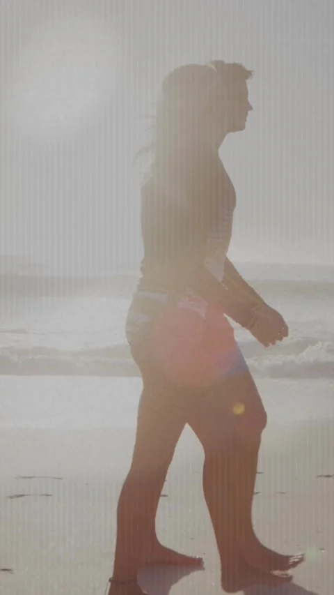 Animation of light spots over caucasian couple walking at beach Vídeo Stock 343083787