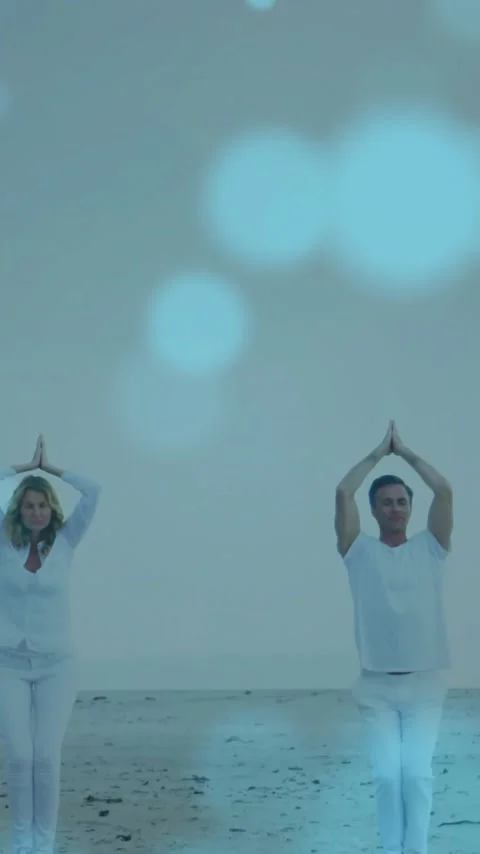 Animation of light spots over caucasian couple practicing yoga at beach Vídeo Stock 343615739