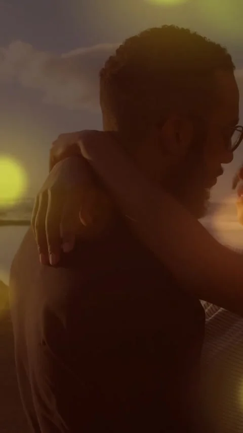 Animation of light spots over couple embracing at seaside Vídeo Stock 344525908